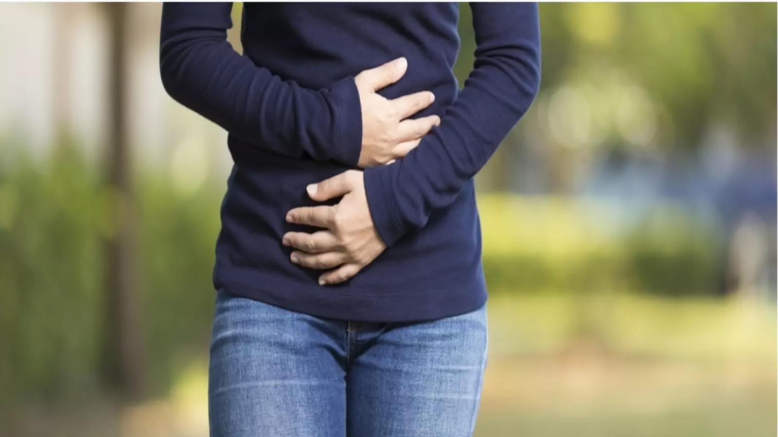 People grabbing their stomach in pain - IBS Management